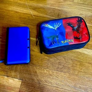 Nintendo 3DS XL in blue with games and accessories